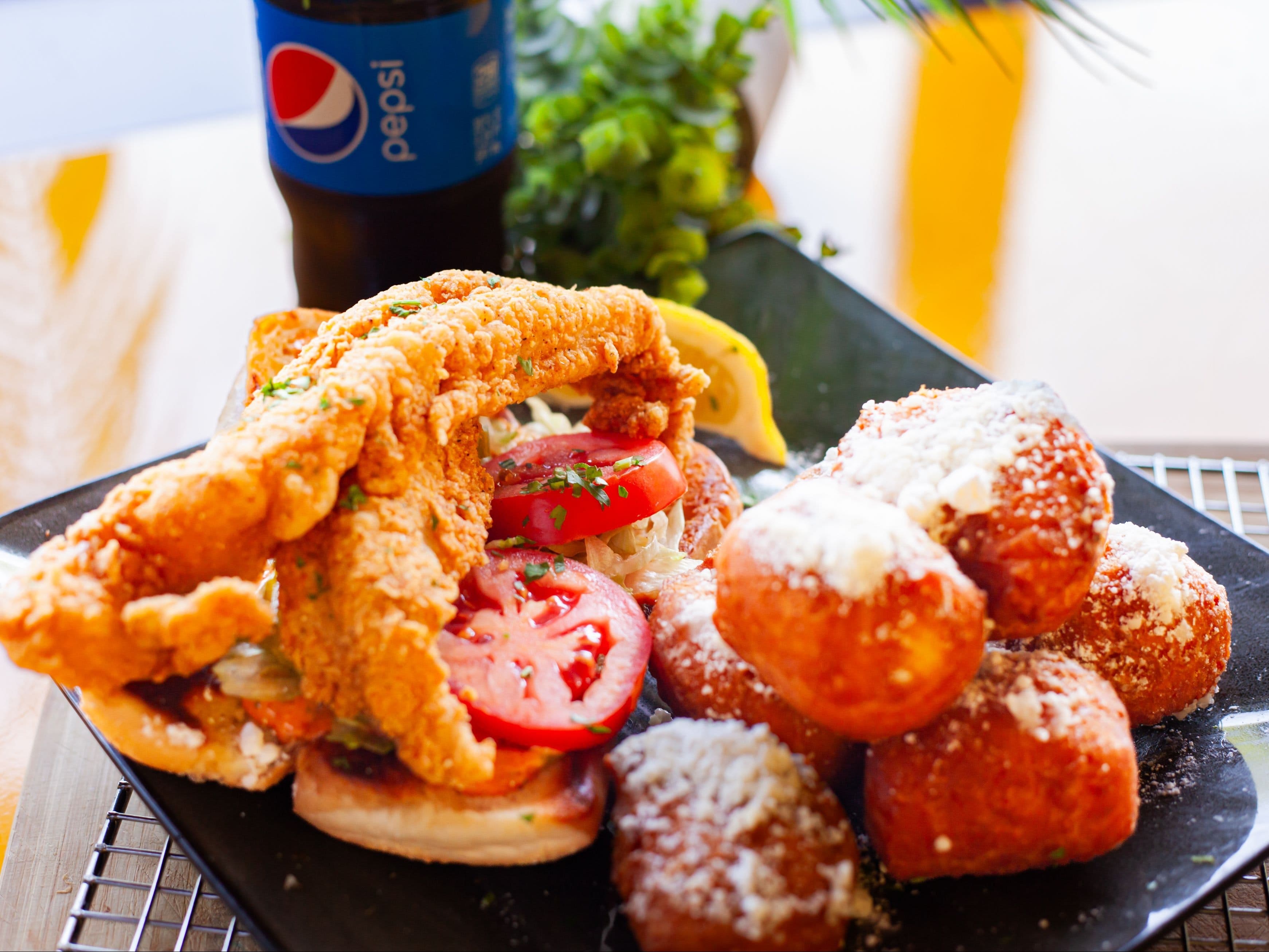 Photo of 'Catfish Po-Boys + Biscuit + Drink' meal.